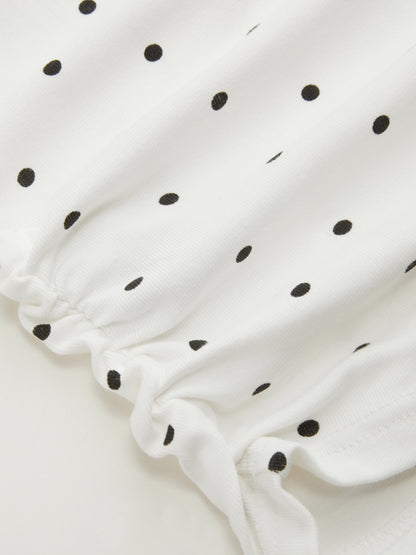Mia - Camiseta acanalada de lunares con cuello barco y minifalda con short interior