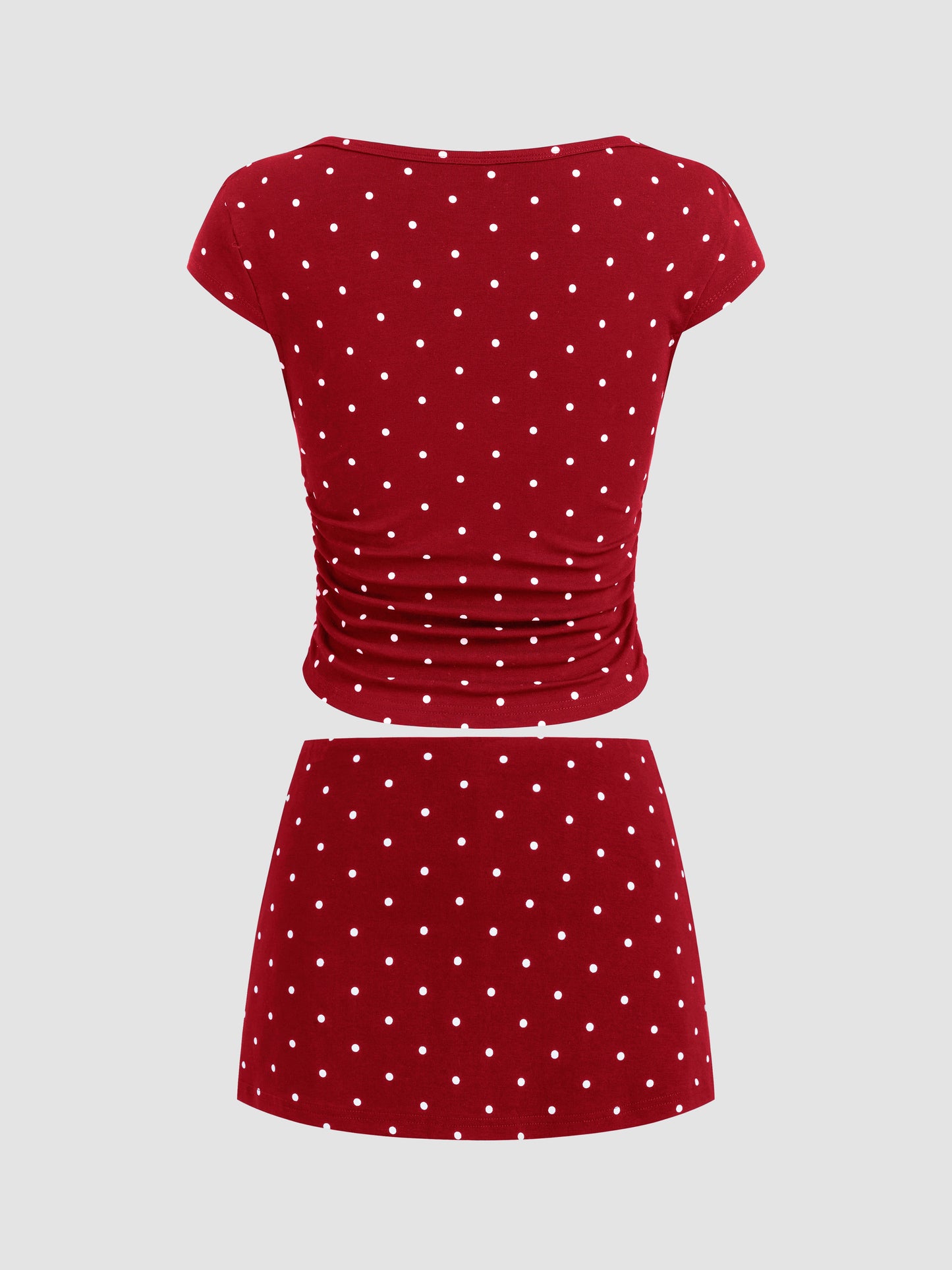 Mia - Camiseta acanalada de lunares con cuello barco y minifalda con short interior